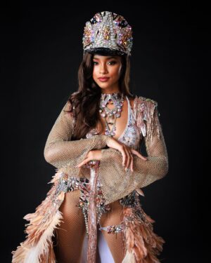 Aché Abrahams Instagram - Ole Time Something Come Back Again! ⚓✨

Thank you to Lost Tribe and the amazing @solangegovia for this masterpiece that made our Miss World Trinidad and Tobago, Aché Abrahams an absolute standout at the Miss World International Pageant! 

#Herstory behind the costume by Solange Govia: 

When I think of modern mas pioneers like Jason Griffith and bands like the Belmont Battalion, their different details to the unique dances that were born out of the the traditional King Sailor, I feel it’s important to commemorate the Golden Era of Sailor Mas portrayals: acknowledging the sophistication, vibrancy and power of this mas character. 

I also started thinking about being a woman in the Carnival industry, and the fact that is also my duty to always honour our womanhood in these sacred traditions. I always want my costumes to remind people that there will always be a place and space for female representation in mas, and I am grateful that Val allowed me this amazing creative opportunity to challenge my design instincts, to inject this sense of femininity and grace into this design, and to just create freely.

From the embellished hat, to the towering collar, to the classic stick, I wanted to pay homage to the opulence that the Sailor Mas experience brings to the streets of Port of Spain. Of course, there had to be a design twist in this Fancy Sailor – the sand-coloured feathered skirt that replaced the bell-bottom pants, to not only represent the first visit of British, French and American naval ships in our nation’s history, but to also highlight where the Caribbean Sea meets the T&T shoreline. For me, it is this simple reminder that through every storm, women have become ‘the glue’ to the Carnival experience. We bring these powerful elements together to define our legacy, and we will always be pivotal in pushing the winds of change forward.”

Photography : @raj.vphotography 
Costume : @solangegovia @carnivaltribe 

#missworld #LAVWAY #missworldtrinidadandtobago 
#SolangeGovia #fancysailor #history #designer 
#carnivaltt