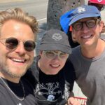 Adam Conover Instagram - What a joy to reunite with the Adam Ruins Everything and G Word creative staffs on the picket line this week and fight for our common needs. I owe everything to the creative people we made these shows. ALL of them deserve a union, and ALL of them deserve to be paid fairly. AMPTP is LITTLE BUGS!!! (Also, see if you can spot the lady who jumped into our group picture even though she didn’t work on the show) Los Angeles, California