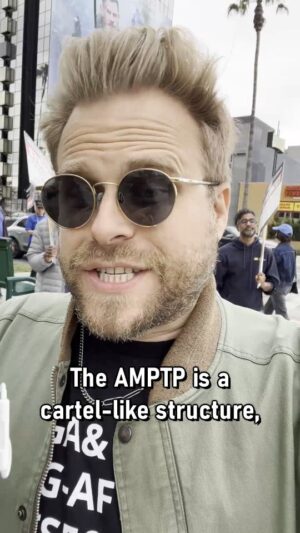 Adam Conover Instagram - Writers Strike explainer: What is the AMPTP, and what's their purpose? #WGAStrong