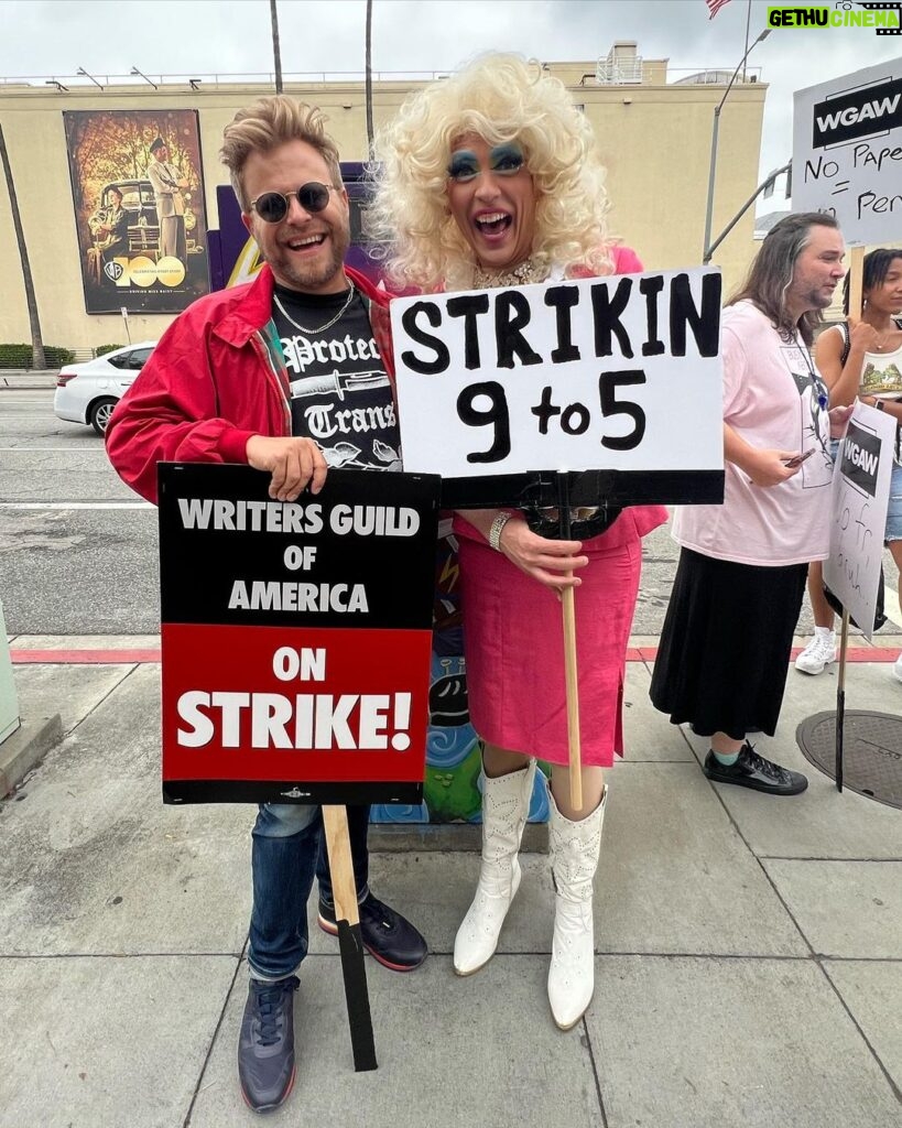 Adam Conover Instagram - Best part of picketing is meeting your heroes. This week I met Dolly at the Pride Picket (@supnebrasska), and Ben Edlund, creator of one of my favorite shows from my childhood. It was an amazing week 5 on the line - can’t wait for next week! Warner Brothers Studios - Burbank, CA