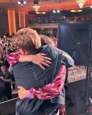 Adam Conover Instagram - Writers just voted 99% in favor of to ratifying our new contract, officially bringing an end to the strike. I’m still processing my emotions, so here’s a dump from the last two weeks:
1) thousands of writers giving our Chief Negotiator @ellestn a standing ovation at the Palladium
2) hugging @angelinaburnett, my sister forever
3) our incredible Director of Research Laura Blum-Smith getting the ovation she deserves 
4-6) the Negotiating Committee and staff who led us steadfastly through the strike. Will be grateful to these folks for the rest of my life
7) with @whipsical. I gave her her first writing job on ARE, and it’s been such a joy to watch her grow into one of the most impactful members of our Guild. Now someone hire this woman - she’s an incredible writer!

Thank you to everyone who made this possible. STRIKES WORK, pass it on!