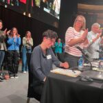 Adam Conover Instagram - Writers just voted 99% in favor of to ratifying our new contract, officially bringing an end to the strike. I’m still processing my emotions, so here’s a dump from the last two weeks: 1) thousands of writers giving our Chief Negotiator @ellestn a standing ovation at the Palladium 2) hugging @angelinaburnett, my sister forever 3) our incredible Director of Research Laura Blum-Smith getting the ovation she deserves 4-6) the Negotiating Committee and staff who led us steadfastly through the strike. Will be grateful to these folks for the rest of my life 7) with @whipsical. I gave her her first writing job on ARE, and it’s been such a joy to watch her grow into one of the most impactful members of our Guild. Now someone hire this woman - she’s an incredible writer! Thank you to everyone who made this possible. STRIKES WORK, pass it on!