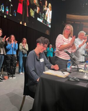 Adam Conover Instagram - Writers just voted 99% in favor of to ratifying our new contract, officially bringing an end to the strike. I’m still processing my emotions, so here’s a dump from the last two weeks:
1) thousands of writers giving our Chief Negotiator @ellestn a standing ovation at the Palladium
2) hugging @angelinaburnett, my sister forever
3) our incredible Director of Research Laura Blum-Smith getting the ovation she deserves 
4-6) the Negotiating Committee and staff who led us steadfastly through the strike. Will be grateful to these folks for the rest of my life
7) with @whipsical. I gave her her first writing job on ARE, and it’s been such a joy to watch her grow into one of the most impactful members of our Guild. Now someone hire this woman - she’s an incredible writer!

Thank you to everyone who made this possible. STRIKES WORK, pass it on!