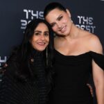 Adriana Lima Instagram - As a true “brasileira”, futebol is in my blood! It is a great honor to be part of the FIFA Family, the FIFAMILY as we call it! As a fan myself, I hope to connect at a greater level this family to the life of this beautiful sport: the fans! Welcome to FIFAN Como uma verdadeira brasileira, o futebol está no meu sangue! Eh uma grande honra fazer parte da família FIFA, a FIFAMILIA como dizemos! Como uma fã também, eu espero conectar em um nível maior essa família com o que da vida a esse lindo esporte: os fãs! Bem vindo ao FIFAN Dress: @viviennewestwood Earrings: @kallatijewelry Shoes: @giuseppezanotti Bag: @jimmychoo Styling: @stylememaeve Hair: @vincentdemoro Make Up: @minkimmakeup Photo: courtesy of @fifa Paris, France