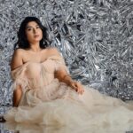 Akshita Bopaiah Instagram - Draped in glamour and wrapped in silver dreams. Channelling elegance in this beautiful mauve dress is @akshitha_bopaiah MUA - @nikithaanandmakeup Decor - @vakshaparivarah Outfit - @charny_mashi . . . . . [Silver foil photoshoot, concept photoshoot, creative photoshoot ideas] One Horizon Productions