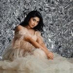 Akshita Bopaiah Instagram - Draped in glamour and wrapped in silver dreams. Channelling elegance in this beautiful mauve dress is @akshitha_bopaiah MUA - @nikithaanandmakeup Decor - @vakshaparivarah Outfit - @charny_mashi . . . . . [Silver foil photoshoot, concept photoshoot, creative photoshoot ideas] One Horizon Productions