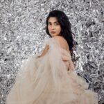Akshita Bopaiah Instagram - Draped in glamour and wrapped in silver dreams. Channelling elegance in this beautiful mauve dress is @akshitha_bopaiah MUA - @nikithaanandmakeup Decor - @vakshaparivarah Outfit - @charny_mashi . . . . . [Silver foil photoshoot, concept photoshoot, creative photoshoot ideas] One Horizon Productions