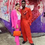 Alexandra Turshen Instagram - Hello from Mom and Dad 💖🧡 #fireislandpremiere was too much fun. Go see this hilarious and heart-felt film by @ihatejoelkim💥 💯 #sustainablefashion moment brought to you by . . . Pink suit: @anothertomorrow (thank you, Keke!) Vintage accessories: @iconstylenyc (thank you, Lara!)