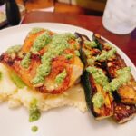 Alicia Garza Instagram - Chicken thighs with crispy skin meets mashed potatoes with charred zucchini and a delicious herby sauce…sauce is made from buttermilk, cilantro, garlic, pumpkin seeds, lemon and jalapeño… vacation looks good on me, yes indeed. #SometimesICook