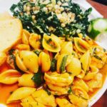 Alicia Garza Instagram - #SometimesICook today was a long and productive and a little bit of a heartbreaking day, all at once. Full super moon got me all in my feels — not for me, but my loved ones who are going through it right now. The world be feelin a little off kilter — and that’s when I cook. Today’s meal is pasta with rundown sauce and shrimp. Rundown sauce made from lemongrass, garlic, tomato paste, ginger, coconut milk, and the shells of the shrimp, combined and cooked down and strained. Fresh herbs and lime zest at the end really make it do what it do — and then a kale salad on the side with grilled corns, grilled green onions, and a dressing made of feta, grilled jalapeño, lemon zest and lemon juice, and buttermilk. Recipe adapted from @nytcooking