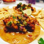 Alicia Garza Instagram - Been a minute since I got down in the kitchen but LAWD after this week I needed to work it out. Al pastor fish tacos, with grilled pineapple salsa. Made that al pastor from scratch — grilled the pineapple, tomatoes, onion, and garlic. Threw dried ancho and guajillo chiles on there too for a minute, toasted some cumin, cloves, and cinnamon sticks. Throw the chiles in some boiling water until they get soft and then put it all in the blender with some of the water from the chiles. Put some red snapper on the grill seasoned only with a little salt. Pan fry some corn tortillas. Salsa has grilled pineapple, cilantro, jalapeño (I ain’t had serranos), olive oil and salt. Just what I needed for the almost end of a long week. Recipe adapted from @nytcooking 📸 @camilo_sol