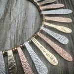 Alysia Reiner Instagram - The Dissent II is here. Modeled by the radiant actor, artist and activist Alysia Reiner.    A limited run of 20 necklaces will be available this holiday season, handcrafted in precious metals.    Materials: 14k gold, 14K rose gold & sterling silver. $3600.   20% of profits will be donated to the National Network of Abortion Funds.   Ships in 2-3 weeks. Order at gabymossdesigns.com or link in bio.   Necklace by @gabymossdesigns Model: @alysiareiner Photographer: @cindytrinh.photo Makeup Artist: @shoshanaswell Hair Stylist: @jimenamuanyc Production Coordinator: @ali_gramz     #RBG #Dissent #DissentNecklace #DissentCollar #StatementNeckace #PowerNecklace #ReproductiveRights #Vote2022 #Roevember   @abortionfunds