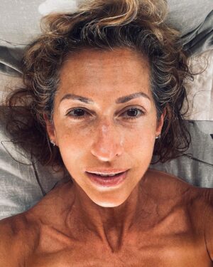 Alysia Reiner Instagram - Birthday selfie. No makeup. No filter. No filler. Wrinkles, freckles (sun damage), grey hair & cellulite included.  My birthday present to myself is cultivating more self love and worthiness AS IS. Those of you who know me know it is tattooed on my wrist ( along with my @msmarvelofficial lightening bolt!) to remind myself to love the world as it is. 

But this year I want to go deeper loving MYSELF as is , feeling worthy and enough, unemployed, wrinkles, bumpy nose, crepy skin , cellulite, gray hair, and all. It’s a privilege to make it this far in my life. Some of my friends died in their 40s.  Some younger, some older. missing you today Barbara, Racheal, Heather, Patricia, & Owen. Also my daddy & Davids dad ( 55 & 47 respectively). It’s a privilege to age. Im learning this, as much as the capitalist patriarchy wants to sell me so much shit to stop the process. 

It’s  been an incredible life so far so many dreams come true,  so many dreams I didn’t even know I had : becoming a volunteer fire fighter, becoming a foster mom, I never even dreamed of having { a healthy relationship with} a teen daughter, and look at this one! Being an activist, producing movies, learning tennis! I love continuing to learn new things to feel like a beginner, and it’s deep discomfort, and to evolve through that. Thank you beloved friend and happens to be brilliant life coach @julieanne.lee for teaching me more about my own worth. Thank you @jessicadefino_ for inspiring me to love myself, free of filter and fillers, warts, and all. Thank you L & D FOR ALL MY INCREDIBLE HOMEMADE PRESENTS MY FAVORITE KIND. AND THANK YOU. @sophchangnyc For taking these super fun pictures and visiting us here in my favorite place on the planet. 

#thesearethegoodolddays #birthdaygirl #birthdayselfie #asis