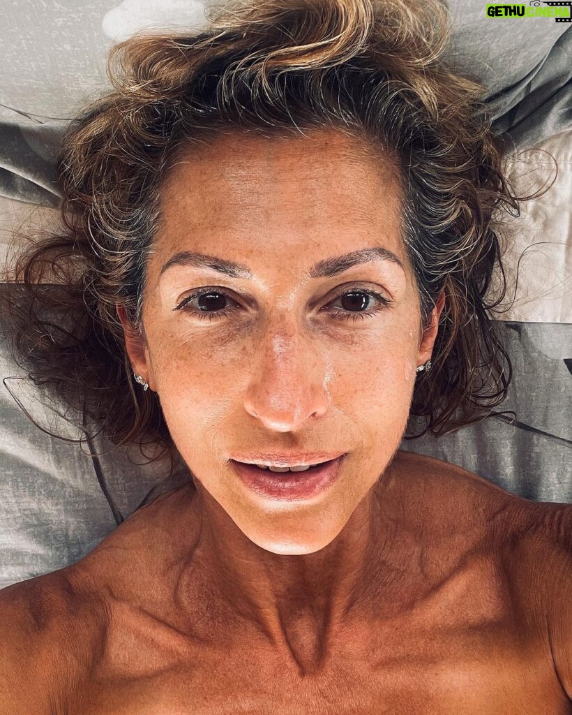 Alysia Reiner Instagram - Birthday selfie. No makeup. No filter. No filler. Wrinkles, freckles (sun damage), grey hair & cellulite included. My birthday present to myself is cultivating more self love and worthiness AS IS. Those of you who know me know it is tattooed on my wrist ( along with my @msmarvelofficial lightening bolt!) to remind myself to love the world as it is. But this year I want to go deeper loving MYSELF as is , feeling worthy and enough, unemployed, wrinkles, bumpy nose, crepy skin , cellulite, gray hair, and all. It’s a privilege to make it this far in my life. Some of my friends died in their 40s. Some younger, some older. missing you today Barbara, Racheal, Heather, Patricia, & Owen. Also my daddy & Davids dad ( 55 & 47 respectively). It’s a privilege to age. Im learning this, as much as the capitalist patriarchy wants to sell me so much shit to stop the process. It’s been an incredible life so far so many dreams come true, so many dreams I didn’t even know I had : becoming a volunteer fire fighter, becoming a foster mom, I never even dreamed of having { a healthy relationship with} a teen daughter, and look at this one! Being an activist, producing movies, learning tennis! I love continuing to learn new things to feel like a beginner, and it’s deep discomfort, and to evolve through that. Thank you beloved friend and happens to be brilliant life coach @julieanne.lee for teaching me more about my own worth. Thank you @jessicadefino_ for inspiring me to love myself, free of filter and fillers, warts, and all. Thank you L & D FOR ALL MY INCREDIBLE HOMEMADE PRESENTS MY FAVORITE KIND. AND THANK YOU. @sophchangnyc For taking these super fun pictures and visiting us here in my favorite place on the planet. #thesearethegoodolddays #birthdaygirl #birthdayselfie #asis Saltaire, Fire Island, NY