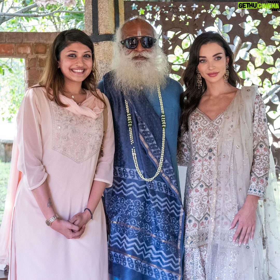 Amy Jackson Instagram - Privileged moment in Coimbatore with @sadhguru - one of the most inspiring visionaries of our time. In between our movie promotions for Mission, we had the opportunity to visit Isha Yoga and meet with the creator himself and learned about his own mission concerning holistic well-being and sustainable causes - all of which is having a hugely positive impact on the world we live in. Whilst spending time with Sadhguru, we discussed all sorts of subjects from raising HAPPY, healthy children, to the world’s future mental health crisis and the importance of creating an environment that fosters wellbeing for ourselves. Mindful eating was a big talking point and having the connection between the food we consume and the health of the soil it comes from - which is currently in a deeply concerning state and why Sadhguru went on a 100 day ‘motorcycle mission’ to save soil! So, thank you Sadhguru your transformative teachings and support for noble initiatives make a profound difference in the world. It was such an honour spending time with you and your volunteers ✨ I can't wait to visit again soon. Also, so much love to @anitadongre for the stunning Salwar I wore for the occasion. Anita continuously promotes traditional crafts and artisans, and advocates for responsible fashion. I love her designs 💘 Swipe to the end for a giggle!!!
