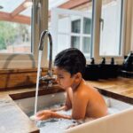 Amy Jackson Instagram - What this Summer is all about ✨ my boys, my furry boys, candy floss and @aloyoga bucket hats, waterfights and sink baths at Grandma’s house… and a whole lotta laughter ✨