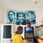 Antonio Dikele Distefano Instagram – Lei è mia madre.
Oggi abbiamo finalmente aperto la nostra prima attività insieme in Angola. 
“Dikele Internet Cafe” è uno spazio ispirato al modello Starbucks dove i ragazzi delle scuole possono studiare, guardare la televisione via cavo e avere accesso a internet di fronte ad un succo e i dolci tipici angolani.

Non so se si capisce dalla foto ma mamma è molto felice. Luanda, Angola