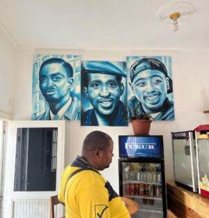 Antonio Dikele Distefano Instagram - Lei è mia madre.
Oggi abbiamo finalmente aperto la nostra prima attività insieme in Angola. 
“Dikele Internet Cafe” è uno spazio ispirato al modello Starbucks dove i ragazzi delle scuole possono studiare, guardare la televisione via cavo e avere accesso a internet di fronte ad un succo e i dolci tipici angolani.

Non so se si capisce dalla foto ma mamma è molto felice.