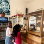 Antonio Dikele Distefano Instagram – Lei è mia madre.
Oggi abbiamo finalmente aperto la nostra prima attività insieme in Angola. 
“Dikele Internet Cafe” è uno spazio ispirato al modello Starbucks dove i ragazzi delle scuole possono studiare, guardare la televisione via cavo e avere accesso a internet di fronte ad un succo e i dolci tipici angolani.

Non so se si capisce dalla foto ma mamma è molto felice. Luanda, Angola