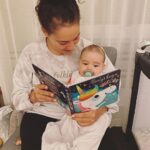 Ash London Instagram - The Taylor Swift merch is a reminder of my ‘old life’ which involved a lot more sleep but a lot less moments of magic like this one….reading stories to my little Bud who is already an avid bookworm.