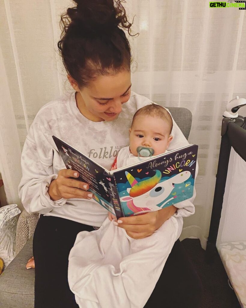 Ash London Instagram - The Taylor Swift merch is a reminder of my ‘old life’ which involved a lot more sleep but a lot less moments of magic like this one….reading stories to my little Bud who is already an avid bookworm.