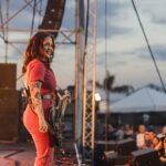 Ashley McBryde Instagram - Gretna Heritage Fest!! Thank you so much for having us and thank you for bringing amazing juju our way. You were incredible! #TheDevilIKnowTour presented by Ariat is rollin’ on and keepin’ the highway hot. Photos by @katiekauss Styled by @blakelyecollier Hair/makeup by @calijeffries @fender @daddarioandco @gretna_fest Gretna, Louisiana