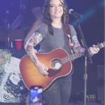 Ashley McBryde Instagram - Life happens in real time. Luckily we get to capture it moment by moment. Thank you for an amazing start to this tour!  The Devil I Know Tour is heating up! And the Devil YOU know wishes you a safe and happy new year. We’ll see you on the road! I’ll be the girl with the smirk on the side of a semi trailer.