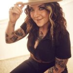 Ashley McBryde Instagram - @katiekauss on that camera shutter. @dayna.anne on that hair and makeup. @blakelyecollier on that look and that fit @pilgrimagefestival on that festival goodness. @stetsonusa on that gorgeous hat on my head.