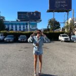 Ashley Nicole Williams Instagram - so I ironically wore the same jean outfit 2 1/2 years ago in front of our first billboard as I did in front of our last. and boy has baby grown. if I could hug that girl and hold her tight, say ya did it kid. 3 seasons as a lead on a tv show. I’m so proud of you. proud of us. cheers to these final episodes, cheers to 4 years of making this show and 3 wildly beautiful seasons, and cheers to leaving a mark on anyone and everyone who loves our show as much as we do. This final season is and always will be for you guys. See u tonight for episode 6. Goddess protect. 🤍 AB