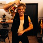 Ashton Irwin Instagram - pass the Pitú on the left hand side 🎉 good vibes backstage with @ryanfleming. This bottle of Brazilian rum was a gift from a lovely fan! We receive many gifts from place to place and just wanna say thank you for sharing your culture’s through these gestures! A lot of the time we can’t get out to see everything we wanna see where we travel so the things you send us make a big difference when it comes to getting a vibe for where we are! ✌️❤️ São Paulo, Brazil