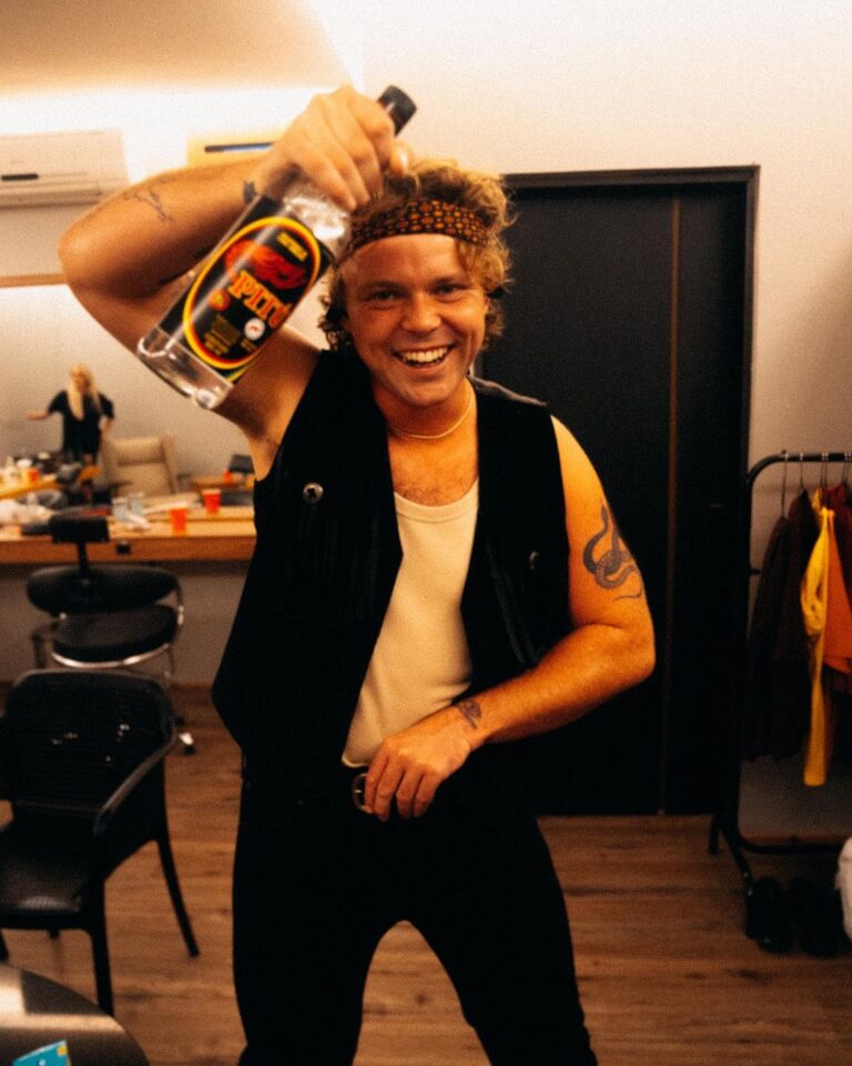 Ashton Irwin Instagram - pass the Pitú on the left hand side 🎉 good vibes backstage with @ryanfleming. This bottle of Brazilian rum was a gift from a lovely fan! We receive many gifts from place to place and just wanna say thank you for sharing your culture’s through these gestures! A lot of the time we can’t get out to see everything we wanna see where we travel so the things you send us make a big difference when it comes to getting a vibe for where we are! ✌️❤️ São Paulo, Brazil