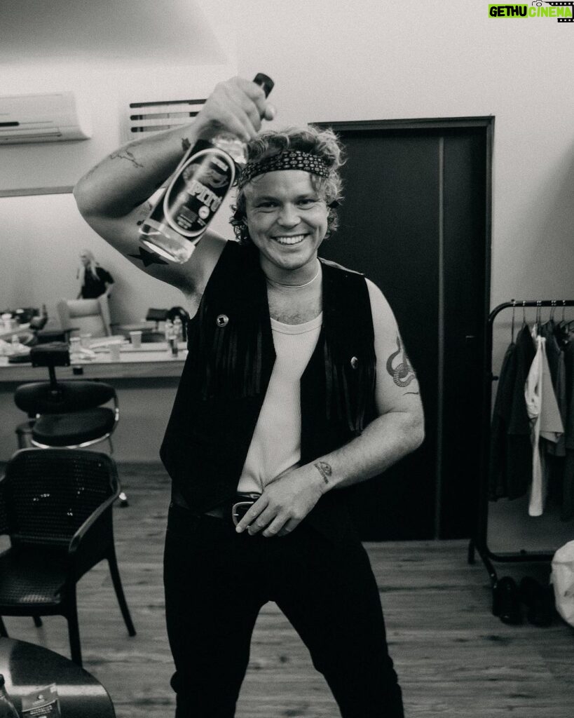 Ashton Irwin Instagram - pass the Pitú on the left hand side 🎉 good vibes backstage with @ryanfleming. This bottle of Brazilian rum was a gift from a lovely fan! We receive many gifts from place to place and just wanna say thank you for sharing your culture’s through these gestures! A lot of the time we can’t get out to see everything we wanna see where we travel so the things you send us make a big difference when it comes to getting a vibe for where we are! ✌❤ São Paulo, Brazil