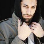 Azim Rizk Instagram – This is how I dramatically put on a hood. How’d I do? 😂 Shout out to the talented @kep.exe who makes me look badass no matter what I do!
.
.
.
.
.
.
.
.
.
.
.
#photography #bestphotographer #sweatshirt #sodramatic #mensfashion #middleeastern #iwanttoworkwith @missionworkshop #dudesinhoodies #curlyhair #menwithbeards #deathstare #intense