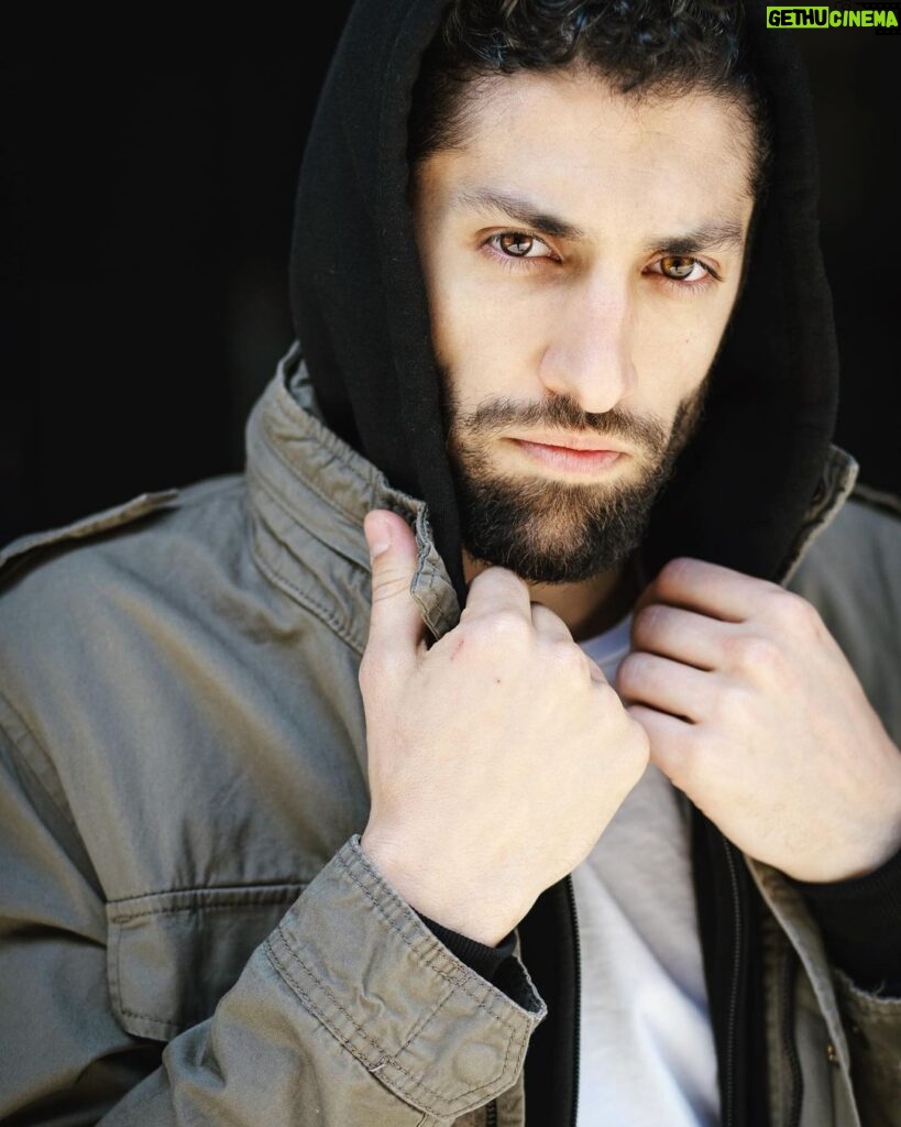 Azim Rizk Instagram - This is how I dramatically put on a hood. How’d I do? 😂 Shout out to the talented @kep.exe who makes me look badass no matter what I do! . . . . . . . . . . . #photography #bestphotographer #sweatshirt #sodramatic #mensfashion #middleeastern #iwanttoworkwith @missionworkshop #dudesinhoodies #curlyhair #menwithbeards #deathstare #intense