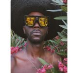 Baloji Tshiani Instagram - Texts go green on vacay mode wit my LOVE 🖤 Slide 1 wearing the shades of the talented @igordieryck X @komono to hate on this new IG’ad policy. ➡️➡️Normalize this, normalize that…The number of peeps that asked me if my daughter was my girlfriend make me want to scream that we need to normalize the HEALTY Daddy-Daughter relationship. Having a strong bond with your daughter should not be perceived as something abnormal! normative society limits. Paradise