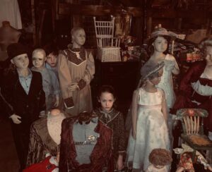 Benjamin Evan Ainsworth Instagram - The set of The Haunting of Bly Manor was amazing. @ameliebeasmith and I loved exploring it behind the scenes. Can you spot us hiding in this photo? 

#thehauntingofblymanor #netflix #creepydolls #ameliebeasmith #benjaminevanainsworth #intrepid
