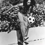 Bob Marley Instagram - “So if a fire mek it bun, and if a blood mek you run, Rasta de pon top!” #Revolution #bobmarley 📷 by @nevillegarrick, Nassau, Dec ‘76 ©️ Fifty-Six Hope Road Music Ltd. #todayinbobslife #reggae #football #futbol #soccer #sports