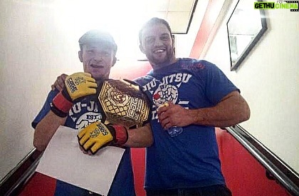 Brett Johns Instagram - 1 Decade ago! 21 year old me and John Phillips after winning the cage warriors world title on September 14th 2013. 2 Fights on one night. A total of 40 minutes of organised chaos that evening. What an experience, I’d never felt so many different emotions that day. I remember it like it was yesterday. Not many fighters get to call themselves world champions in this game. @cagewarriors @johnphillipsufc