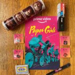 Brian K. Vaughan Instagram - NOW STREAMING?! Our friends at @primevideo have apparently dropped all eight episodes of PAPER GIRLS a day early for you fine folks, so you can watch it right now, just about anywhere in the world! And after you finish your binge, please hit the link in my bio to find out how to win this special prize pack, containing a poster signed by creator @cliffchiang and all four Paper Girls (with a badass collector’s tube to keep it safe!), a very special 12-pack of Paper Girls pencils designed by Cliff and manufactured by legendary art supplier @blackwing, four rare pins created for SDCC, a coveted slap bracelet (!), and even this delectable cassette-cookie (still fresh!) baked by Sugar Babies exclusively for our first screening. Oh, and a canvas Cleveland Preserver tote bag I totally forgot to include in this pic! Anyway, thanks so much for watching, and I hope you love this series as much as I do.