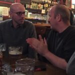 Brian K. Vaughan Instagram - Tomorrow! All generous paid subscribers to Exploding Giraffe will be able to listen in LIVE as I nervously record the debut episode of my new podcast-thing MATURE READERS with my favorite writer in comics (presuming Alan Moore is really retired), GARTH ENNIS, seen here belittling me for ordering a hazy IPA, probably. It’s all happening this Friday at 2pm Pacific/5pm Eastern. I realize that hour will be the middle of the workday for some of you employed-types, but come on, all of your colleagues are just watching March Madness anyway, so shut your (home) office door, grab an Anchor Steam or other Ennis-approved libation, and join us for an hour of hopefully not-too-awkward chitchat about comics, violence, sex, and Garth’s tireless defense of ALIEN 3. If you can’t make it, these two Luddites will do our best to record the talk, but that will also only be available to members of The Tower (not a pyramid scheme, just what you call a bunch of giraffes), so if you haven’t become a paid subscriber yet, there’s still plenty of time to join our pack (link in bio) before I send out the private link tomorrow. Thanks for listening, and for supporting the completion of SPECTATORS, my new graphic novel with @niko_henrichon. You’re the best. #garthennis #bkv #beer