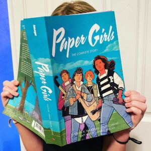 Brian K. Vaughan Instagram - In comic shops next week (so you may want to ask your friendly neighborhood retailer to set one aside today), it’s PAPER GIRLS: THE COMPLETE STORY, an awesome new paperback edition that even a precocious 10-year-old can hold aloft! This collection contains ALL THIRTY ISSUES of the Eisner Award-winning series for less than fifty bucks, and features a stunning new cover by co-creator @cliffchiang. More than anything I’ve ever written, I think this time-twisty adventure really benefits from being devoured in just a few sittings (or maybe one epic binge-read), so this edition makes the perfect gift for any young adult in your life who’s ready to discover that the 1980s were actually a much shittier decade than our nostalgic generation may have led them to believe. And there's a fantastic adaptation in the works from @amazonstudios with four of the best young actors ever put to film, so order this book now so you can be one of those annoying readers who brags about loving a thing before everybody else got hip to it. #PaperGirls #ImageComics #MyDaughterLikesAllTheSwearing