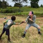 Briana Evigan Instagram - Behind the scenes having some fun while getting work done! 😁 Working with communities has the potential to create a ripple effect of positive change. When individuals make a difference in one person's life or in a community, it often inspires others to do the same. What’s one good thing you have done with your community recently? Let us know below! #wildlifeconservation #conservation #africa #communityfirst #foodsecurity #sustainability