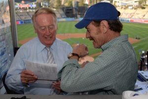 Bryan Cranston Instagram - A part of my childhood died yesterday. That may sound dramatic, and maybe it is, but it is how I’m feeling today. Los Angeles Dodgers’ legendary announcer, Vin Scully passed away at 94. What a brilliant life he led, and what an important part of my life he served. From the time I was able to understand what the radio was I would listen to Dodger baseball games. It was the beginning of a lifelong joy. Vin was never just about the score of the game. His stories made you feel like you were with him… like he was sharing a story just for you. As a child that was often a bedtime story, as I’d hide my transistor radio under my pillow to avoid parental detection. When times were tough, Vin was there to ease my pain or insecurities with the power of distraction. Because even if it was for only the next three hours, listening to Vin’s voice made me feel safe. Comforted. One of my greatest thrills was introducing Vin to my daughter, Taylor, at the ESPY’S in 2017, after I had presented Vin with the Icon Award. Taylor, an adult, and a catcher in her little league experience, nervously confessed to Vin that she listened to him her whole life… just like her dad.
His signature opening statement is indelible in my memory, “Hi everybody, and a very pleasant good evening to you, wherever you may be.” I’m here, Vin…I’m right here.
