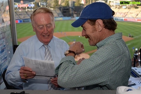 Bryan Cranston Instagram - A part of my childhood died yesterday. That may sound dramatic, and maybe it is, but it is how I’m feeling today. Los Angeles Dodgers’ legendary announcer, Vin Scully passed away at 94. What a brilliant life he led, and what an important part of my life he served. From the time I was able to understand what the radio was I would listen to Dodger baseball games. It was the beginning of a lifelong joy. Vin was never just about the score of the game. His stories made you feel like you were with him… like he was sharing a story just for you. As a child that was often a bedtime story, as I’d hide my transistor radio under my pillow to avoid parental detection. When times were tough, Vin was there to ease my pain or insecurities with the power of distraction. Because even if it was for only the next three hours, listening to Vin’s voice made me feel safe. Comforted. One of my greatest thrills was introducing Vin to my daughter, Taylor, at the ESPY’S in 2017, after I had presented Vin with the Icon Award. Taylor, an adult, and a catcher in her little league experience, nervously confessed to Vin that she listened to him her whole life… just like her dad. His signature opening statement is indelible in my memory, “Hi everybody, and a very pleasant good evening to you, wherever you may be.” I’m here, Vin…I’m right here.