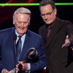 Bryan Cranston Instagram - A part of my childhood died yesterday. That may sound dramatic, and maybe it is, but it is how I’m feeling today. Los Angeles Dodgers’ legendary announcer, Vin Scully passed away at 94. What a brilliant life he led, and what an important part of my life he served. From the time I was able to understand what the radio was I would listen to Dodger baseball games. It was the beginning of a lifelong joy. Vin was never just about the score of the game. His stories made you feel like you were with him… like he was sharing a story just for you. As a child that was often a bedtime story, as I’d hide my transistor radio under my pillow to avoid parental detection. When times were tough, Vin was there to ease my pain or insecurities with the power of distraction. Because even if it was for only the next three hours, listening to Vin’s voice made me feel safe. Comforted. One of my greatest thrills was introducing Vin to my daughter, Taylor, at the ESPY’S in 2017, after I had presented Vin with the Icon Award. Taylor, an adult, and a catcher in her little league experience, nervously confessed to Vin that she listened to him her whole life… just like her dad. His signature opening statement is indelible in my memory, “Hi everybody, and a very pleasant good evening to you, wherever you may be.” I’m here, Vin…I’m right here.