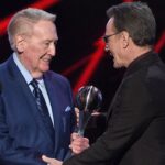 Bryan Cranston Instagram - A part of my childhood died yesterday. That may sound dramatic, and maybe it is, but it is how I’m feeling today. Los Angeles Dodgers’ legendary announcer, Vin Scully passed away at 94. What a brilliant life he led, and what an important part of my life he served. From the time I was able to understand what the radio was I would listen to Dodger baseball games. It was the beginning of a lifelong joy. Vin was never just about the score of the game. His stories made you feel like you were with him… like he was sharing a story just for you. As a child that was often a bedtime story, as I’d hide my transistor radio under my pillow to avoid parental detection. When times were tough, Vin was there to ease my pain or insecurities with the power of distraction. Because even if it was for only the next three hours, listening to Vin’s voice made me feel safe. Comforted. One of my greatest thrills was introducing Vin to my daughter, Taylor, at the ESPY’S in 2017, after I had presented Vin with the Icon Award. Taylor, an adult, and a catcher in her little league experience, nervously confessed to Vin that she listened to him her whole life… just like her dad. His signature opening statement is indelible in my memory, “Hi everybody, and a very pleasant good evening to you, wherever you may be.” I’m here, Vin…I’m right here.