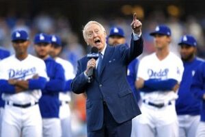 Bryan Cranston Instagram - A part of my childhood died yesterday. That may sound dramatic, and maybe it is, but it is how I’m feeling today. Los Angeles Dodgers’ legendary announcer, Vin Scully passed away at 94. What a brilliant life he led, and what an important part of my life he served. From the time I was able to understand what the radio was I would listen to Dodger baseball games. It was the beginning of a lifelong joy. Vin was never just about the score of the game. His stories made you feel like you were with him… like he was sharing a story just for you. As a child that was often a bedtime story, as I’d hide my transistor radio under my pillow to avoid parental detection. When times were tough, Vin was there to ease my pain or insecurities with the power of distraction. Because even if it was for only the next three hours, listening to Vin’s voice made me feel safe. Comforted. One of my greatest thrills was introducing Vin to my daughter, Taylor, at the ESPY’S in 2017, after I had presented Vin with the Icon Award. Taylor, an adult, and a catcher in her little league experience, nervously confessed to Vin that she listened to him her whole life… just like her dad.
His signature opening statement is indelible in my memory, “Hi everybody, and a very pleasant good evening to you, wherever you may be.” I’m here, Vin…I’m right here.