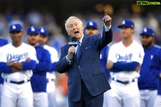 Bryan Cranston Instagram - A part of my childhood died yesterday. That may sound dramatic, and maybe it is, but it is how I’m feeling today. Los Angeles Dodgers’ legendary announcer, Vin Scully passed away at 94. What a brilliant life he led, and what an important part of my life he served. From the time I was able to understand what the radio was I would listen to Dodger baseball games. It was the beginning of a lifelong joy. Vin was never just about the score of the game. His stories made you feel like you were with him… like he was sharing a story just for you. As a child that was often a bedtime story, as I’d hide my transistor radio under my pillow to avoid parental detection. When times were tough, Vin was there to ease my pain or insecurities with the power of distraction. Because even if it was for only the next three hours, listening to Vin’s voice made me feel safe. Comforted. One of my greatest thrills was introducing Vin to my daughter, Taylor, at the ESPY’S in 2017, after I had presented Vin with the Icon Award. Taylor, an adult, and a catcher in her little league experience, nervously confessed to Vin that she listened to him her whole life… just like her dad. His signature opening statement is indelible in my memory, “Hi everybody, and a very pleasant good evening to you, wherever you may be.” I’m here, Vin…I’m right here.