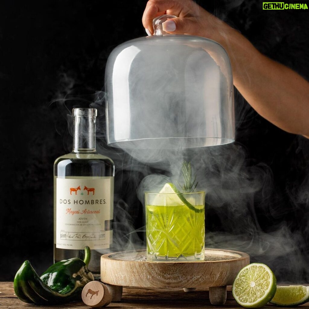 Bryan Cranston Instagram - It’s nearly the weekend, right? I like a bit of spice with my @doshombres margarita. Let me know if you’re brave enough to try... DH Margarita 1.5oz. Dos Hombres Mezcal 3/4oz. Agave Syrup 3/4oz. Lime Juice 3/4oz. Roasted Poblano Puree Pinch of Salt Add all ingredients to a shaker tin filled with ice, shake vigorously, double strain over ice in a rocks glass. Garnish with a lime wheel and *optional smoked rosemary sprig. *Roasted Poblano Puree: High flame on gas stove. Add poblano directly over flame, allow skin to bubble and blacken (2-3 min on each side), flip every few minutes, DO NOT allow to catch fire or turn to white ash, remove charred poblano and place in a small ice bath to cool, remove skin and discard, cut to remove stem, seeds and ribs; add to food processor, pulse until smooth. *Smoked Rosemary: Carefully smoke the end of rosemary sprig with a kitchen torch and blow out after a few seconds for extra essence.
