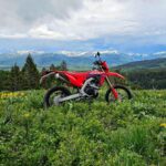 Burt Jenner Instagram - Feel like I'm not supposed to be riding without a 10mm on my chest if I'm going to be crossing these trails solo... stopped to take this picture and immediately felt the urge to check the tree line lol... if you've ever seen the "bear come out of the ground moto video" you know what I'm talking about... having said that, the locals say the bears ain't shit compared to the moose... evidently the biggest moose I've ever seen, 5 minutes before this photo, was still haunting me... @idaho_pilot where you at?!?